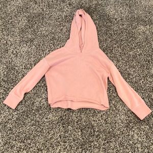 This is a cropped pink sweater and it is great for winter.